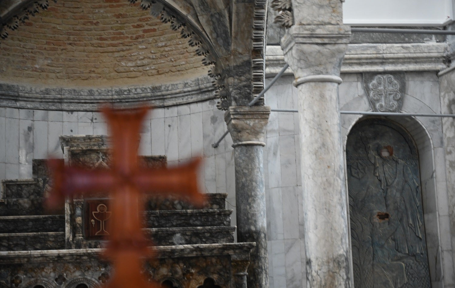 Faces were cut out of metalwork in al-Tahira church in Qaraqosh when ISIS took over the city, as seen in this photo from March 2, 2021. Photo: Bilind T. Abdullah / Rudaw